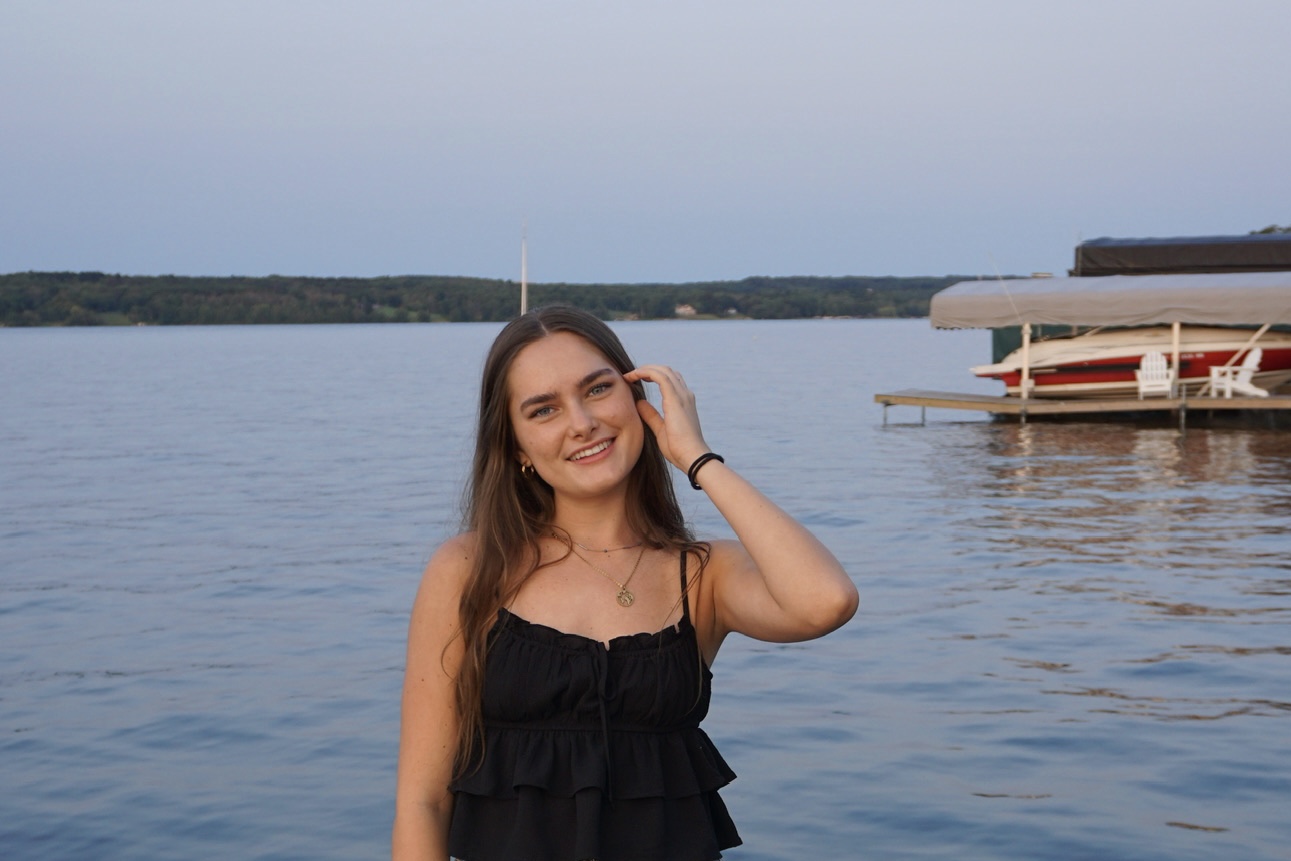 Audrey Merna on a dock smiling.